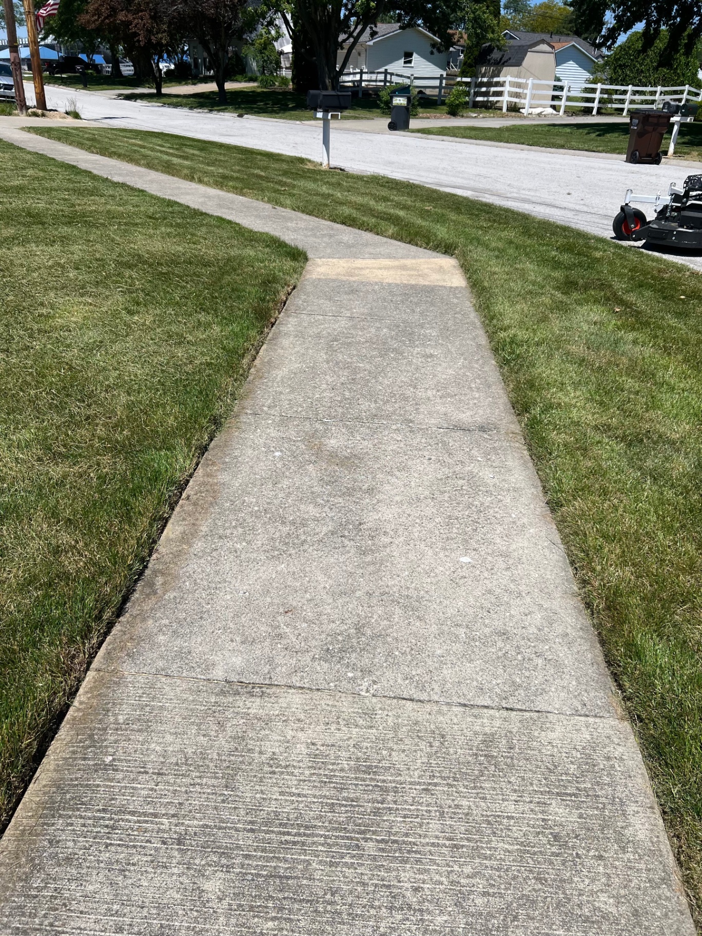 Sidewalk with crisply edged and trimmed lawn on both sides